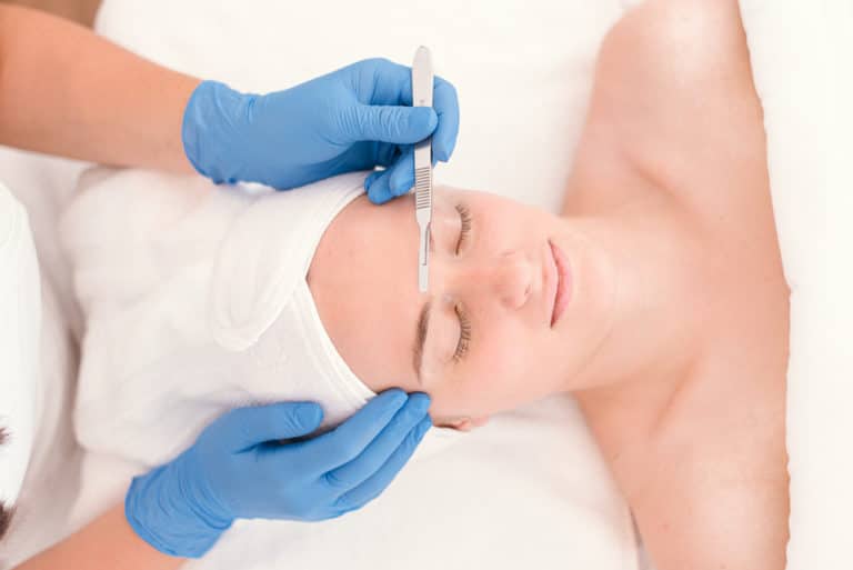 woman receiving Asthetik Dermaplaning Facial