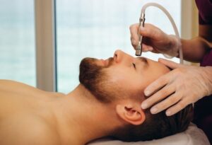 man getting a microdermabrasion facial